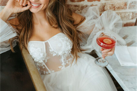 Relaxed and radiant in the AW Janet Wedding Dress, perfect for a fun and intimate celebration.